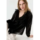 Semitransparente camisa con volantes